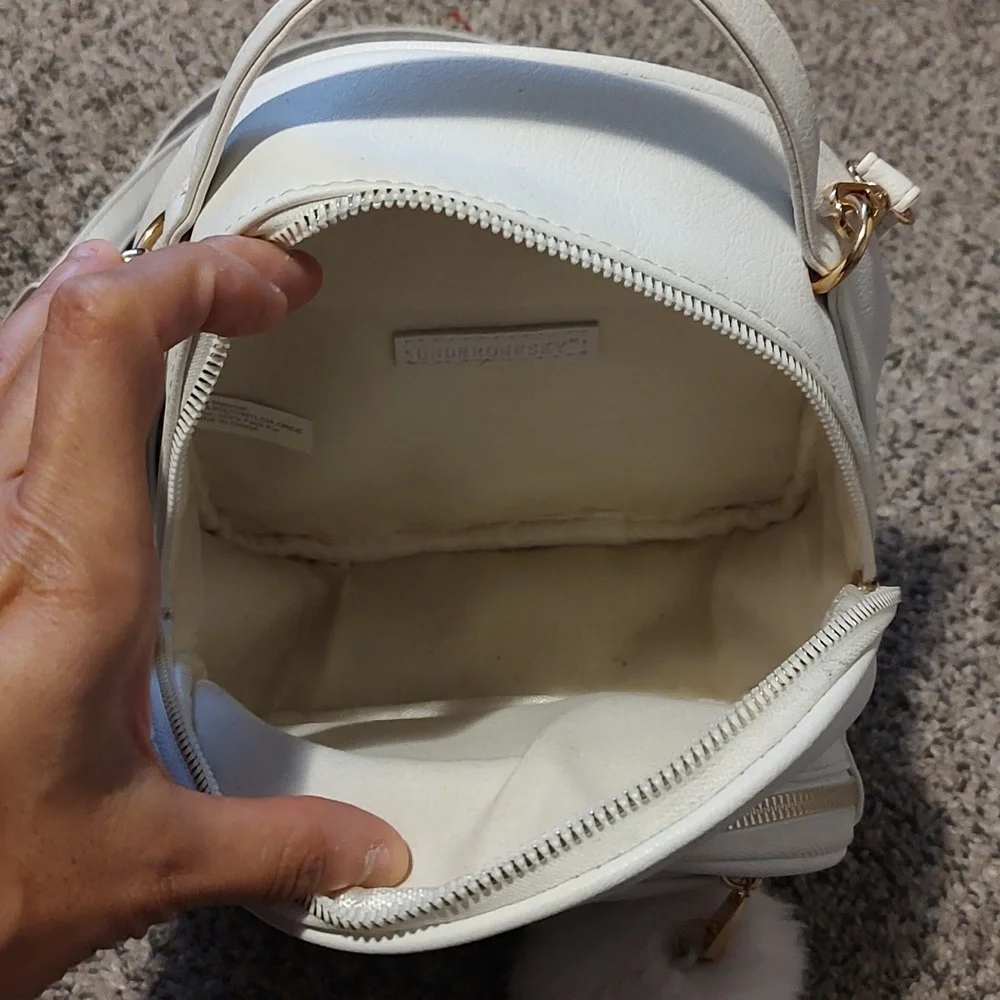 Girls white backpack with Pom